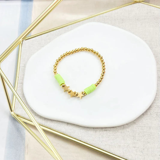Pulsera dorada con estrellas y detalles en verde neón - The Perfect Gift